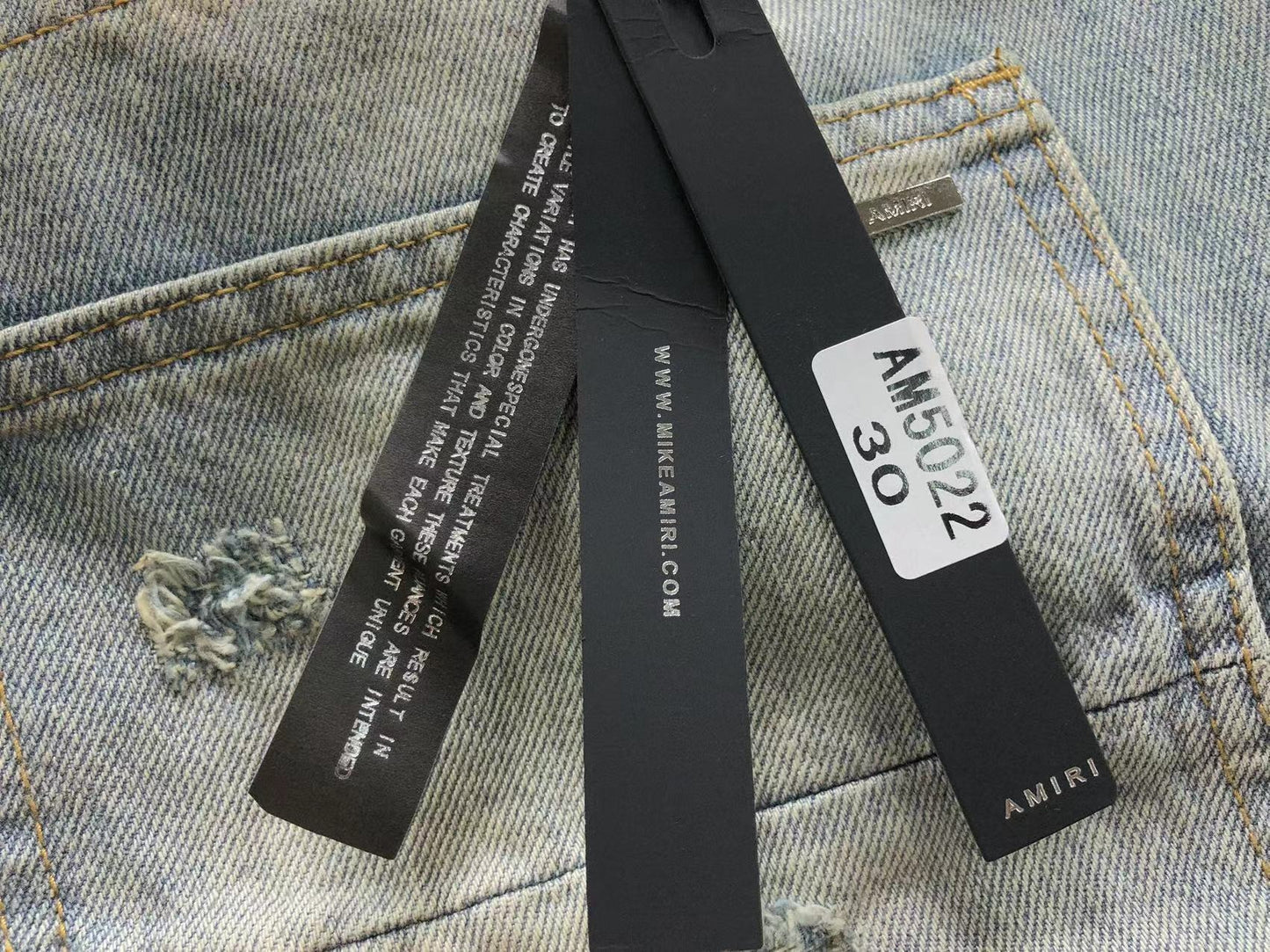Calça AMIRI Dirty Wash Carpenter Jeans
