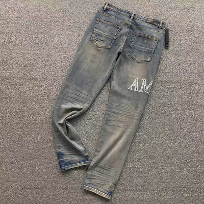 Calça AMIRI Vintage Logo Washed Denim