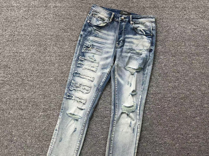 Calça AMIRI Vintage Destroyed Logo Denim (Ice Wash)