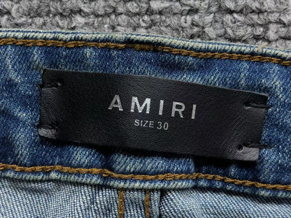 Calça AMIRI Light Wash Destroyed Denim