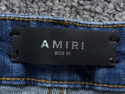 Calça AMIRI Vintage Destroyed Logo Denim (Ice Wash)