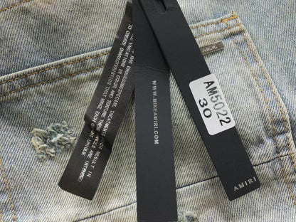 Calça AMIRI Dirty Wash Carpenter Jeans