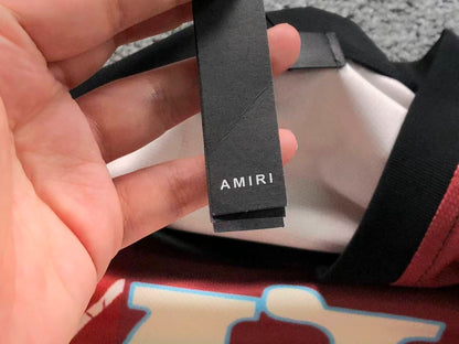 Camiseta AMIRI Champion XXVI Varsit