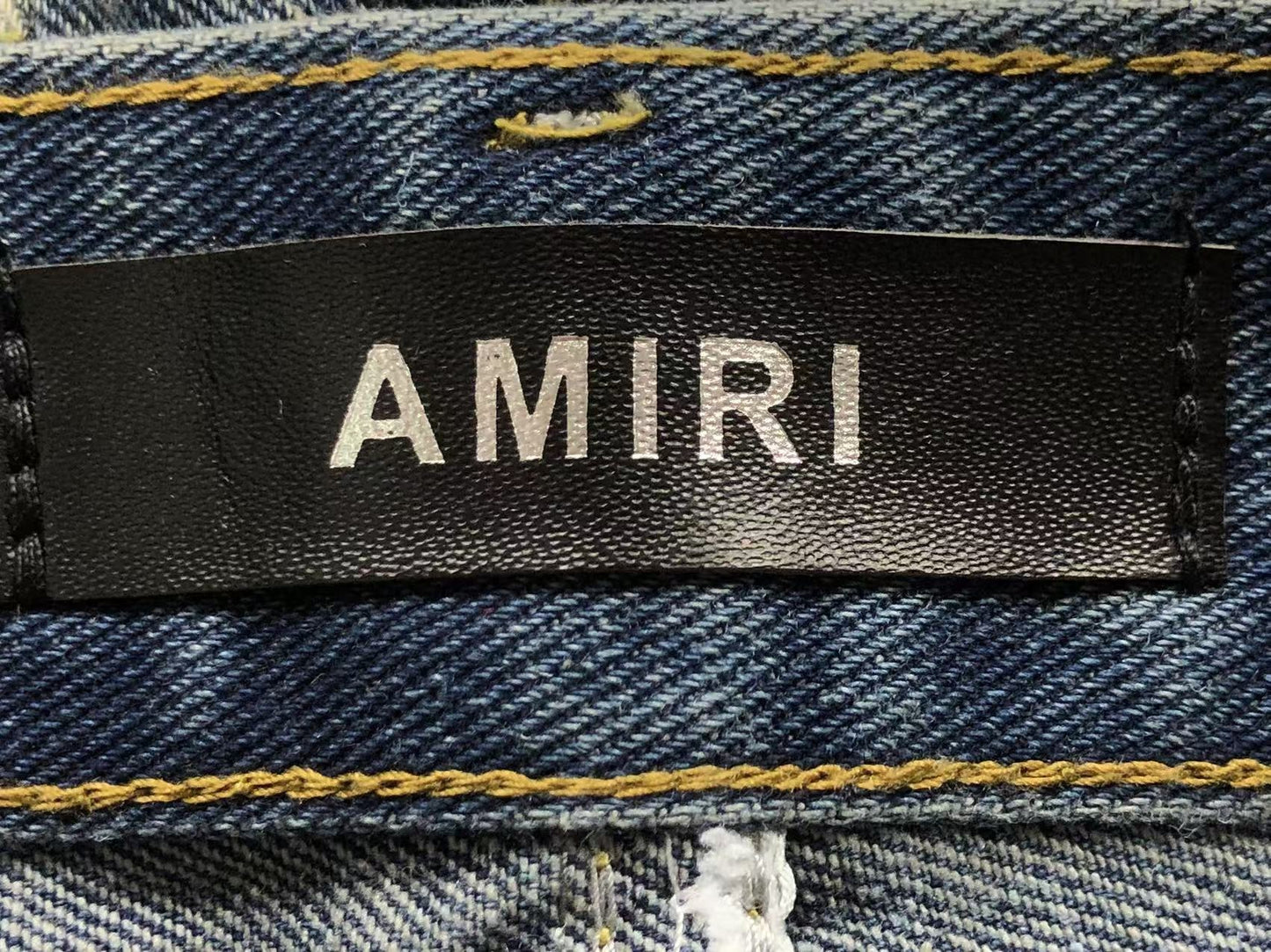 Calça AMIRI Gothic Patch Flared Trousers