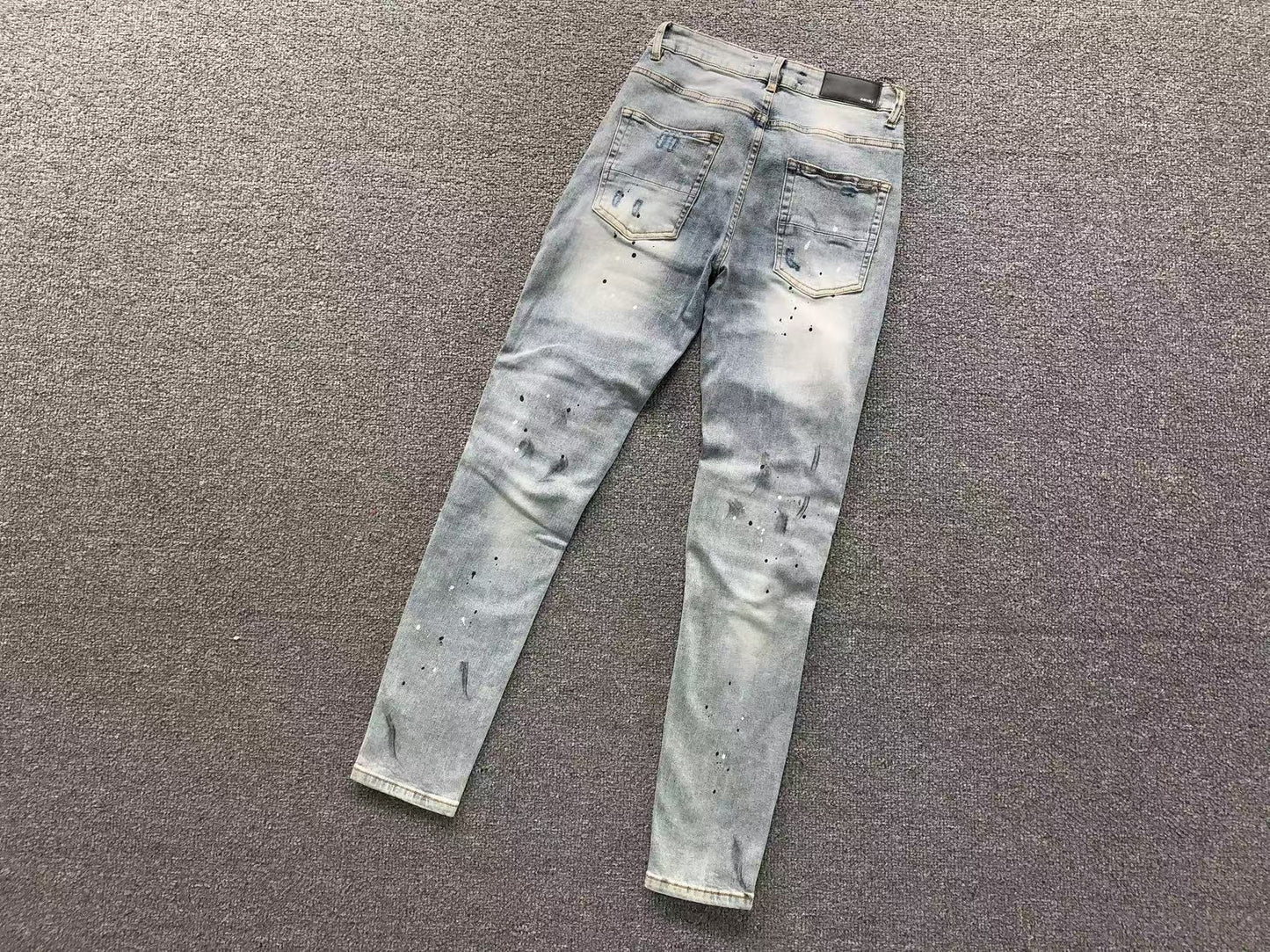 Calça AMIRI Ice Destroyed Paint Denim