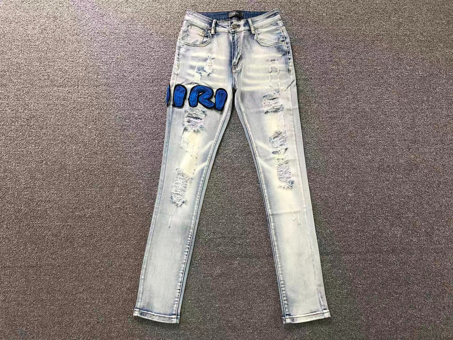 Calça AMIRI Ice Blue Patch Denim