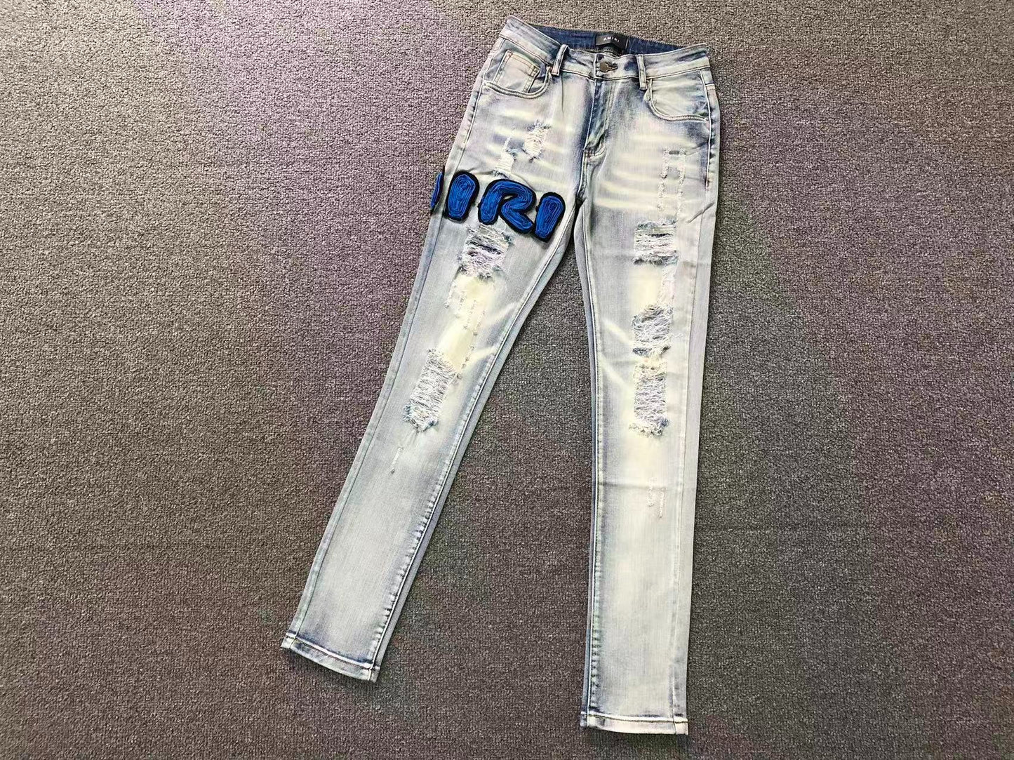 Calça AMIRI Ice Blue Patch Denim
