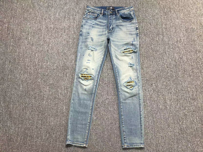 Calça AMIRI Light Wash Destroyed Denim