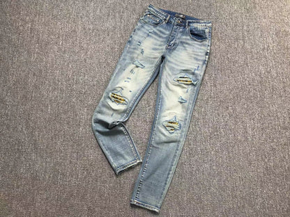 Calça AMIRI Light Wash Destroyed Denim