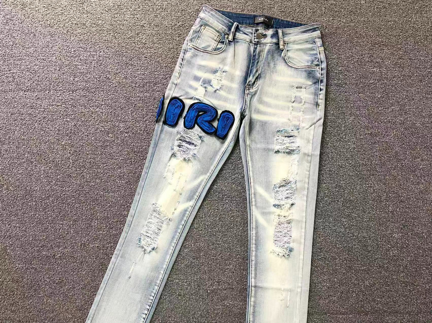 Calça AMIRI Ice Blue Patch Denim