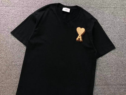 Camiseta AMI Paris Coração Dourado