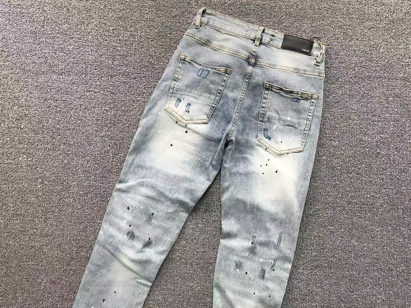 Calça AMIRI Ice Destroyed Paint Denim
