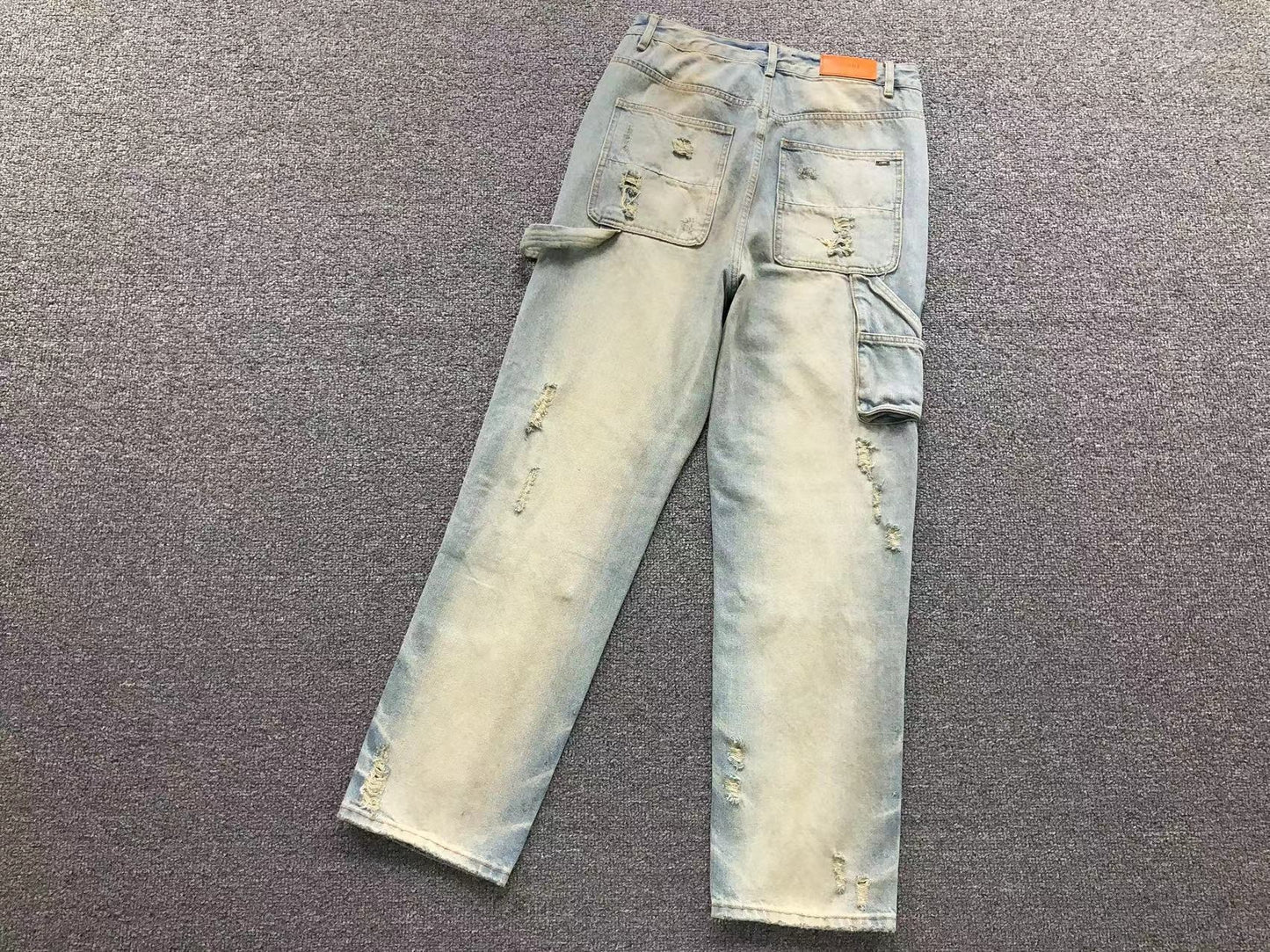 Calça AMIRI Dirty Wash Carpenter Jeans