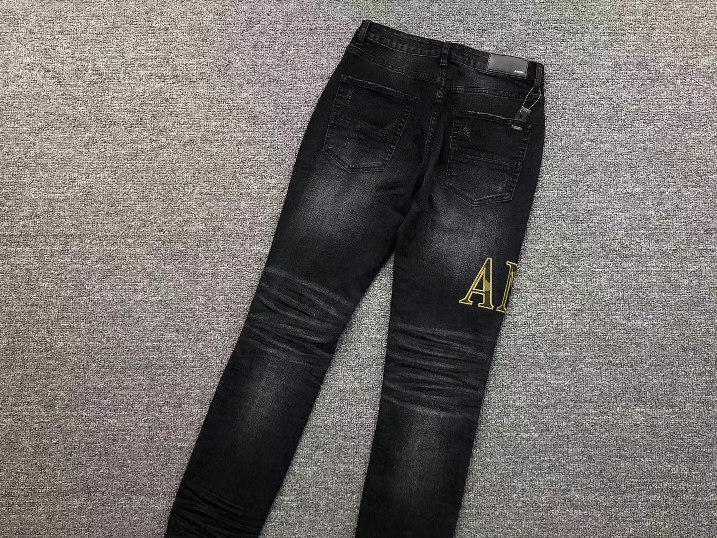 Calça AMIRI Gold Logo Black Denim