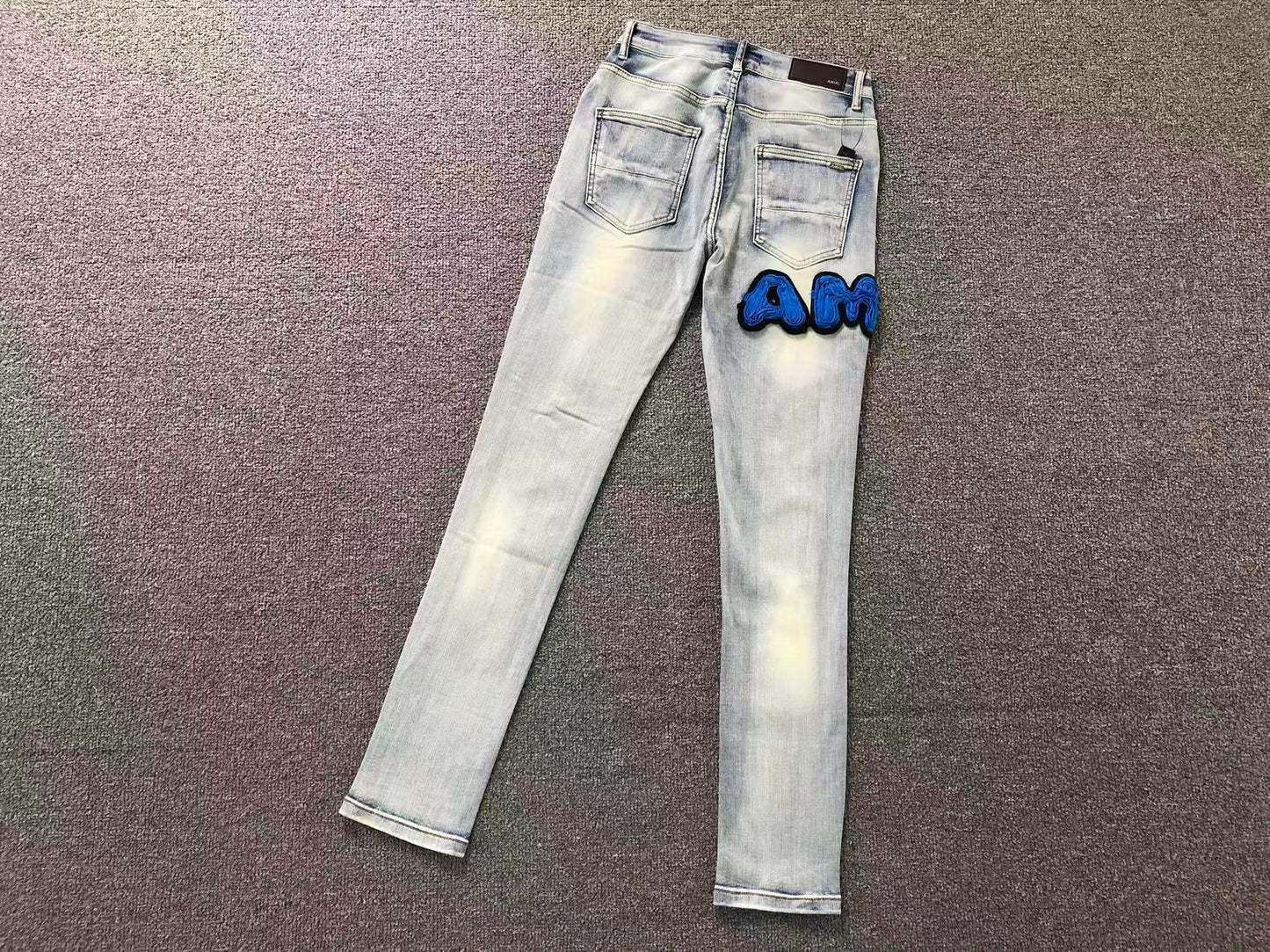 Calça AMIRI Ice Blue Patch Denim