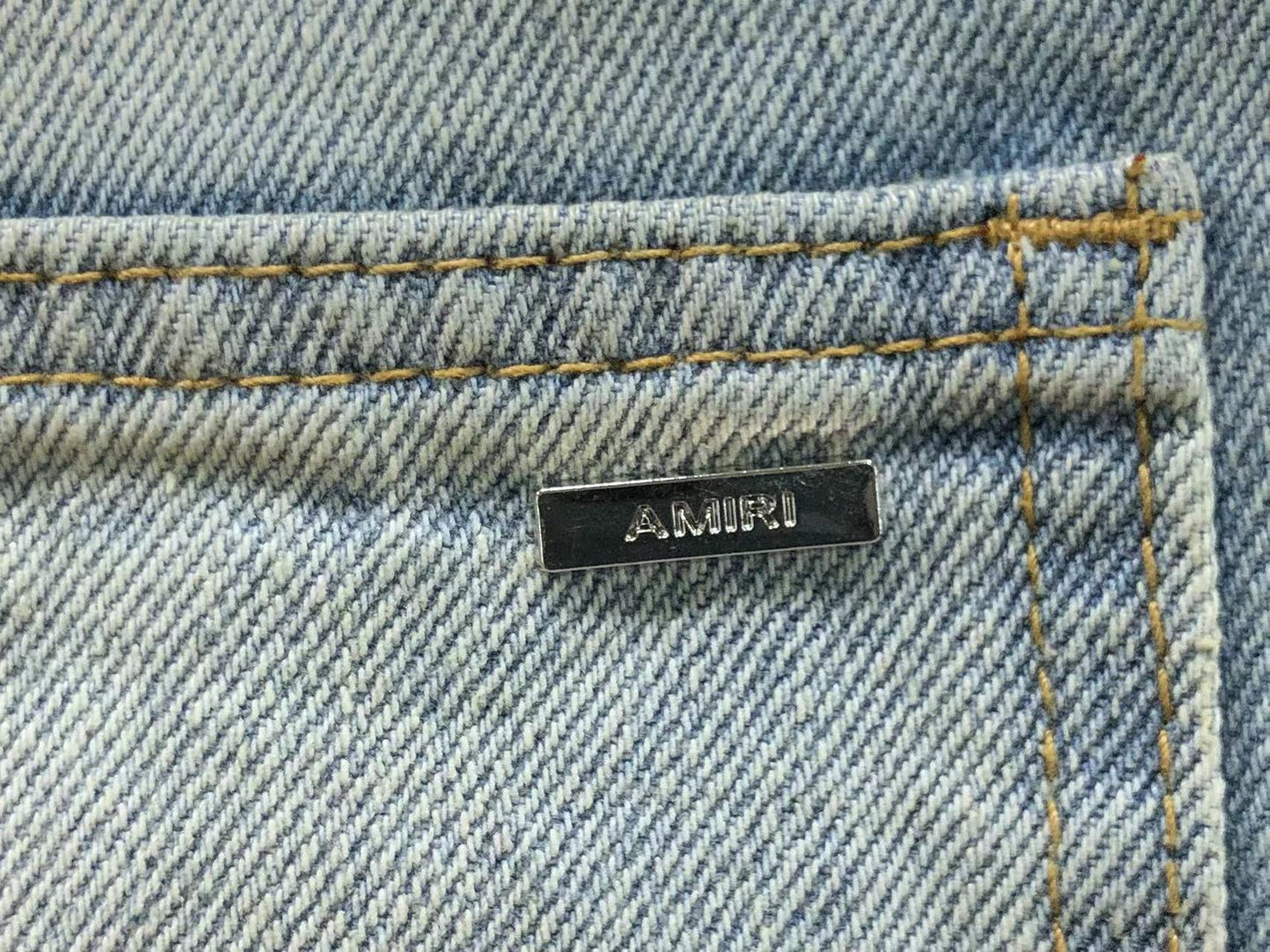 Calça AMIRI Dirty Wash Carpenter Jeans
