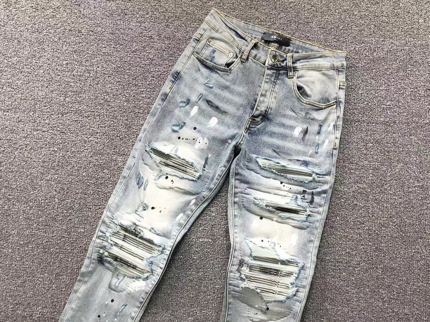 Calça AMIRI Ice Destroyed Paint Denim