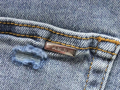 Calça AMIRI Ice Destroyed Paint Denim