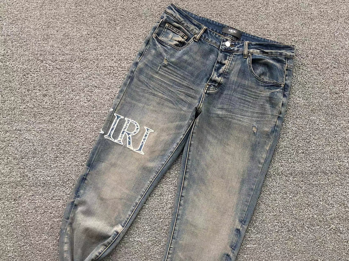 Calça AMIRI Vintage Logo Washed Denim