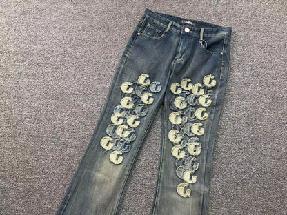 Calça AMIRI Gothic Patch Flared Trousers