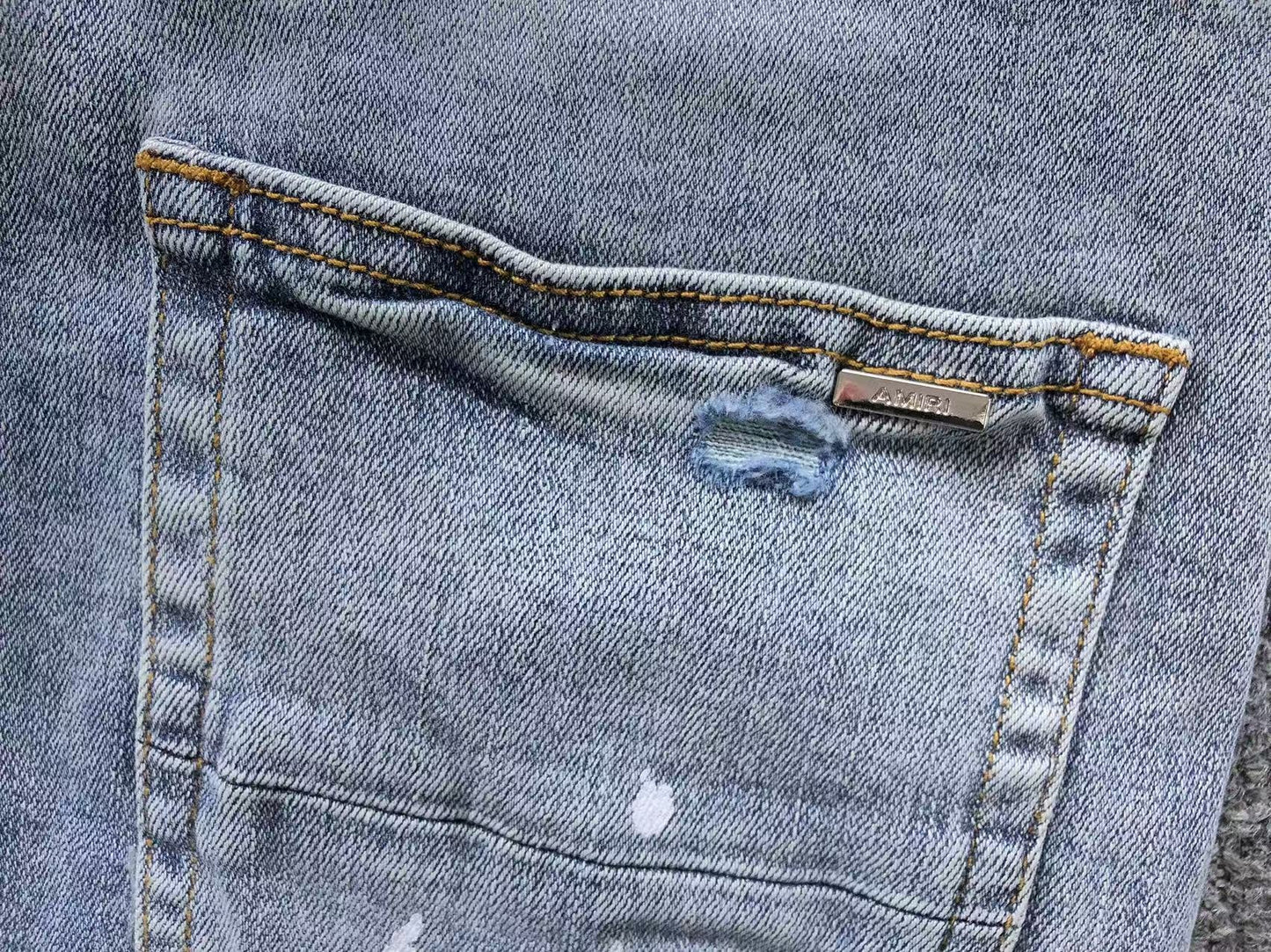 Calça AMIRI Ice Destroyed Paint Denim