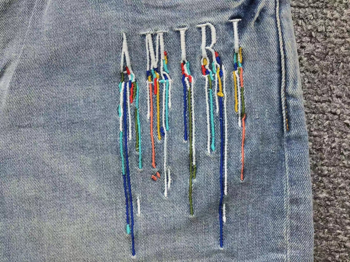 Calça AMIRI Paint Drip Light Wash