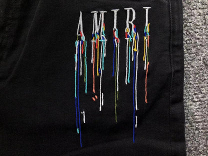 Calça AMIRI Paint Drip Light Wash