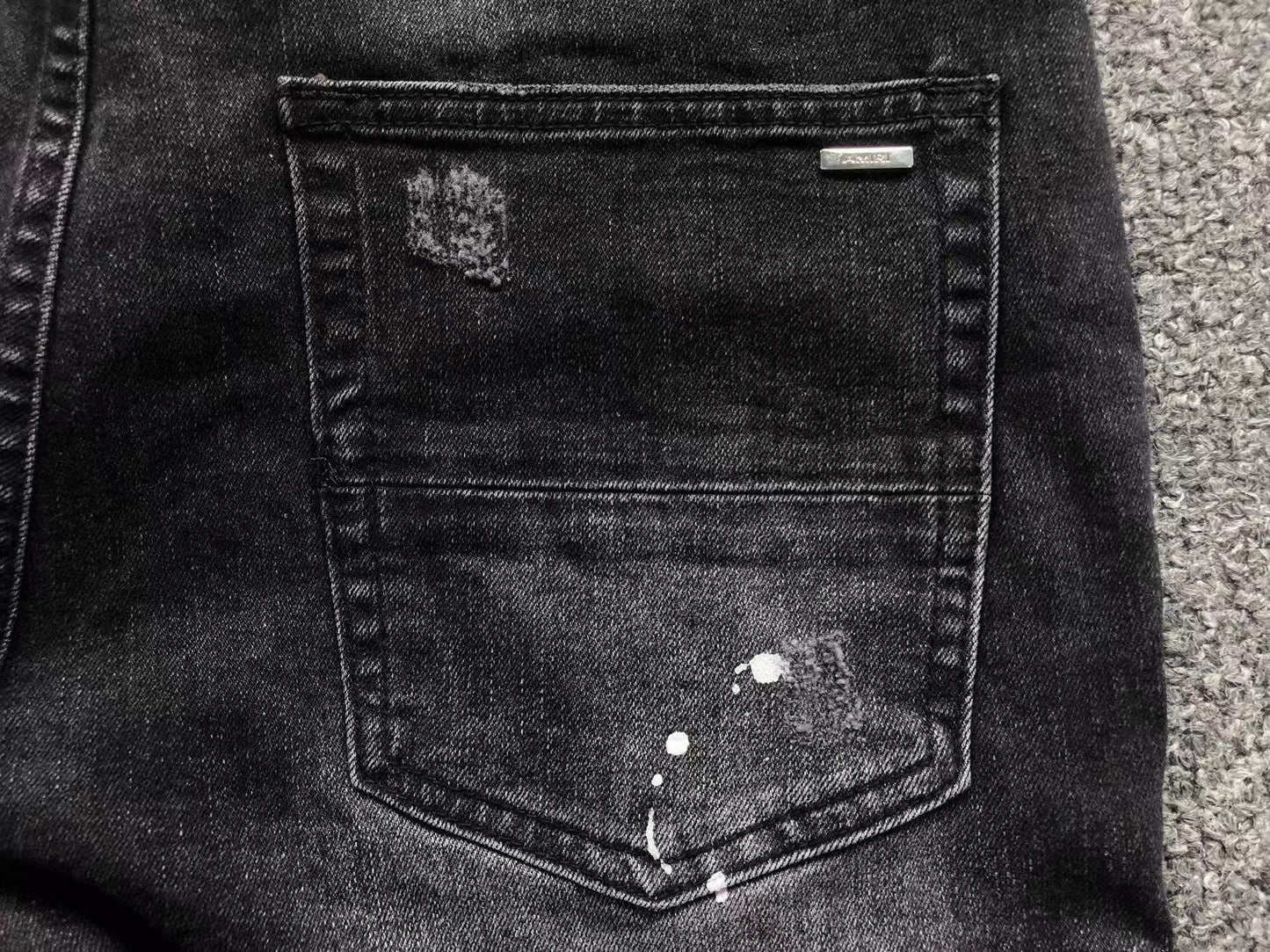 Calça AMIRI Black Paint Wash Denim