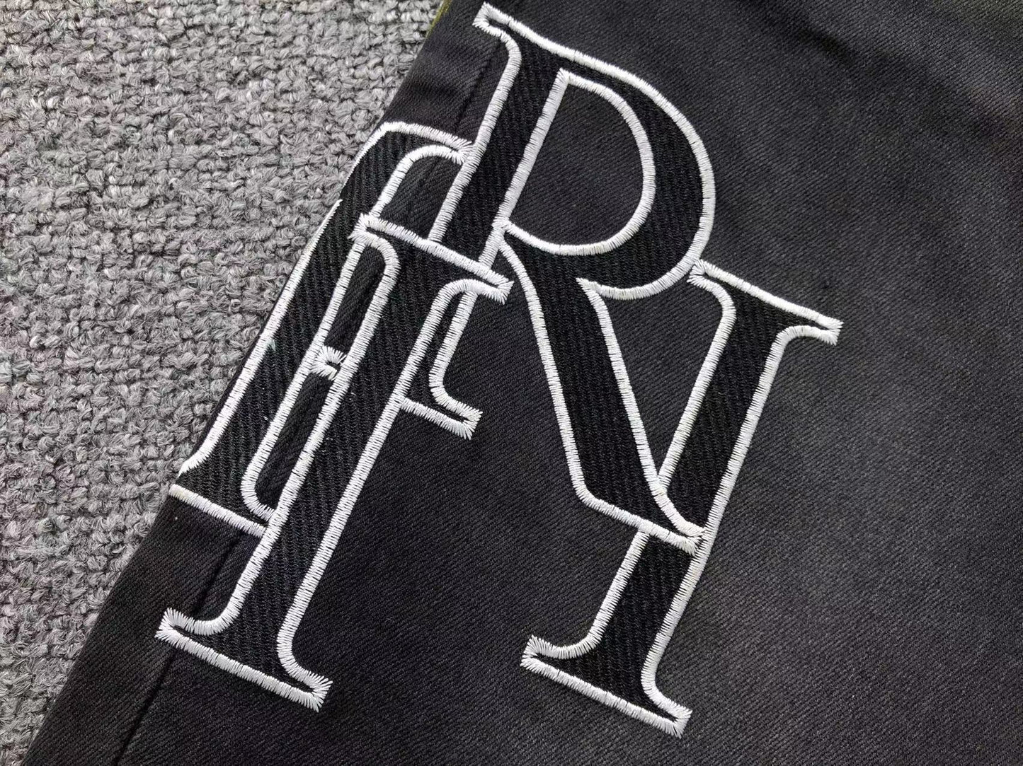 Calça AMIRI Logo Paint Splatter Black Denim
