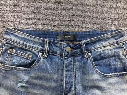 Calça AMIRI Light Wash Destroyed Denim