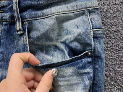 Calça AMIRI Vintage Destroyed Logo Denim (Ice Wash)