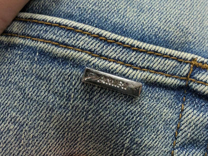 Calça AMIRI Light Wash Destroyed Denim